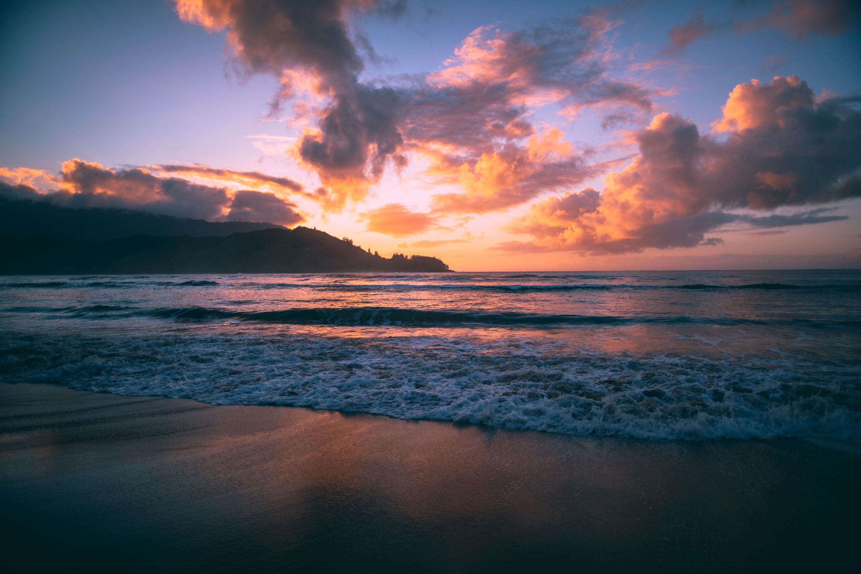 Hanalei Bay shoreline with mountains in the background, Kauai